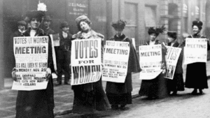 Vintage black and white image of women protesting in support of Votes for Women